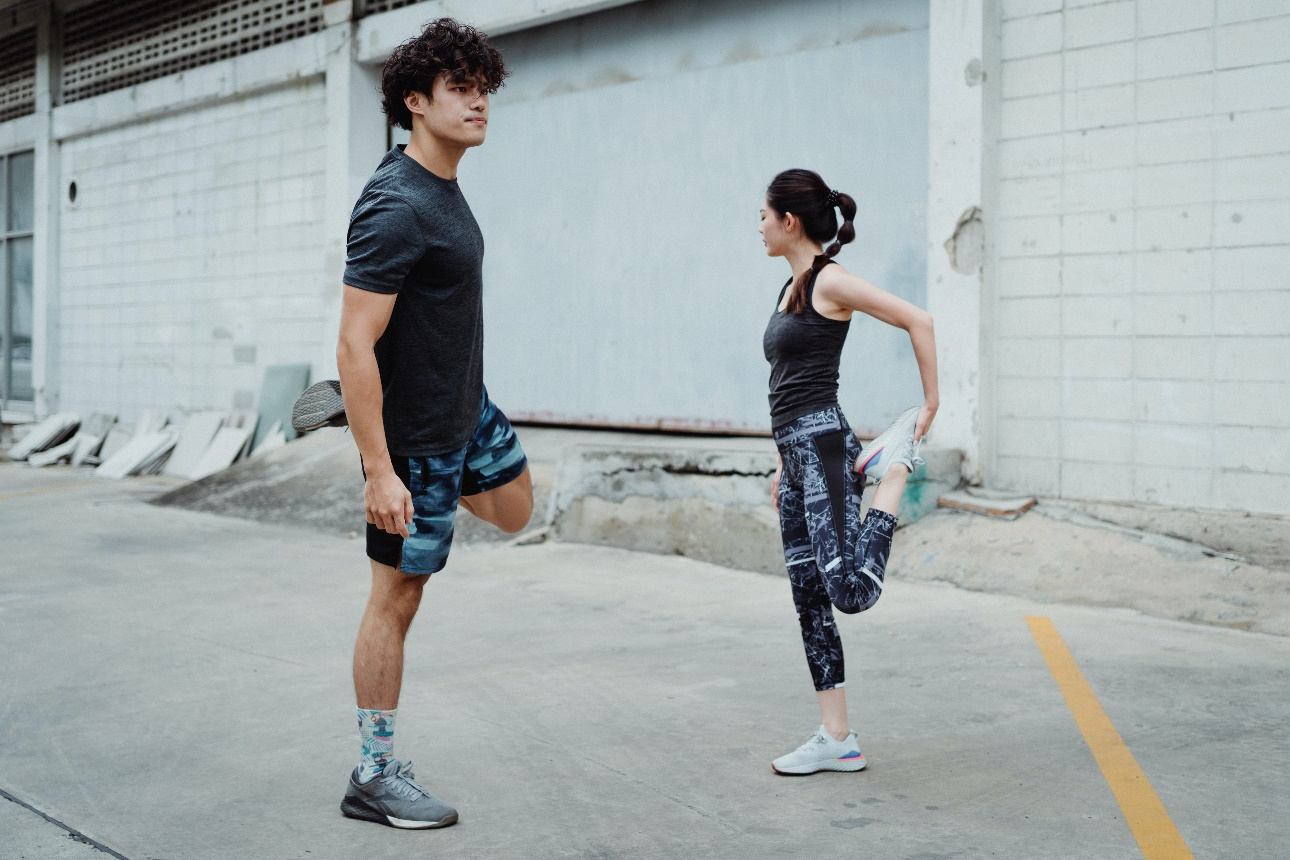 Runners stretching before running