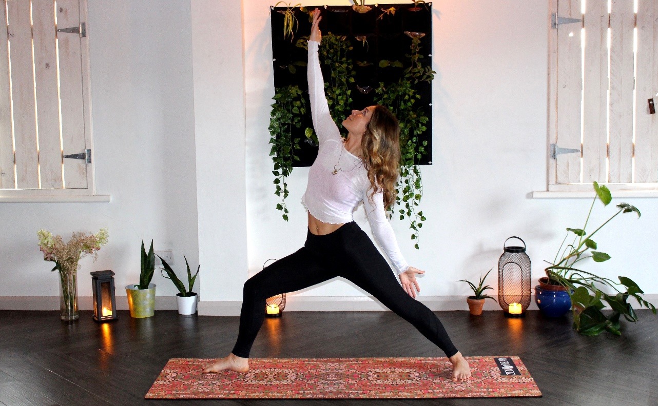 A woman doing yoga on a mat
