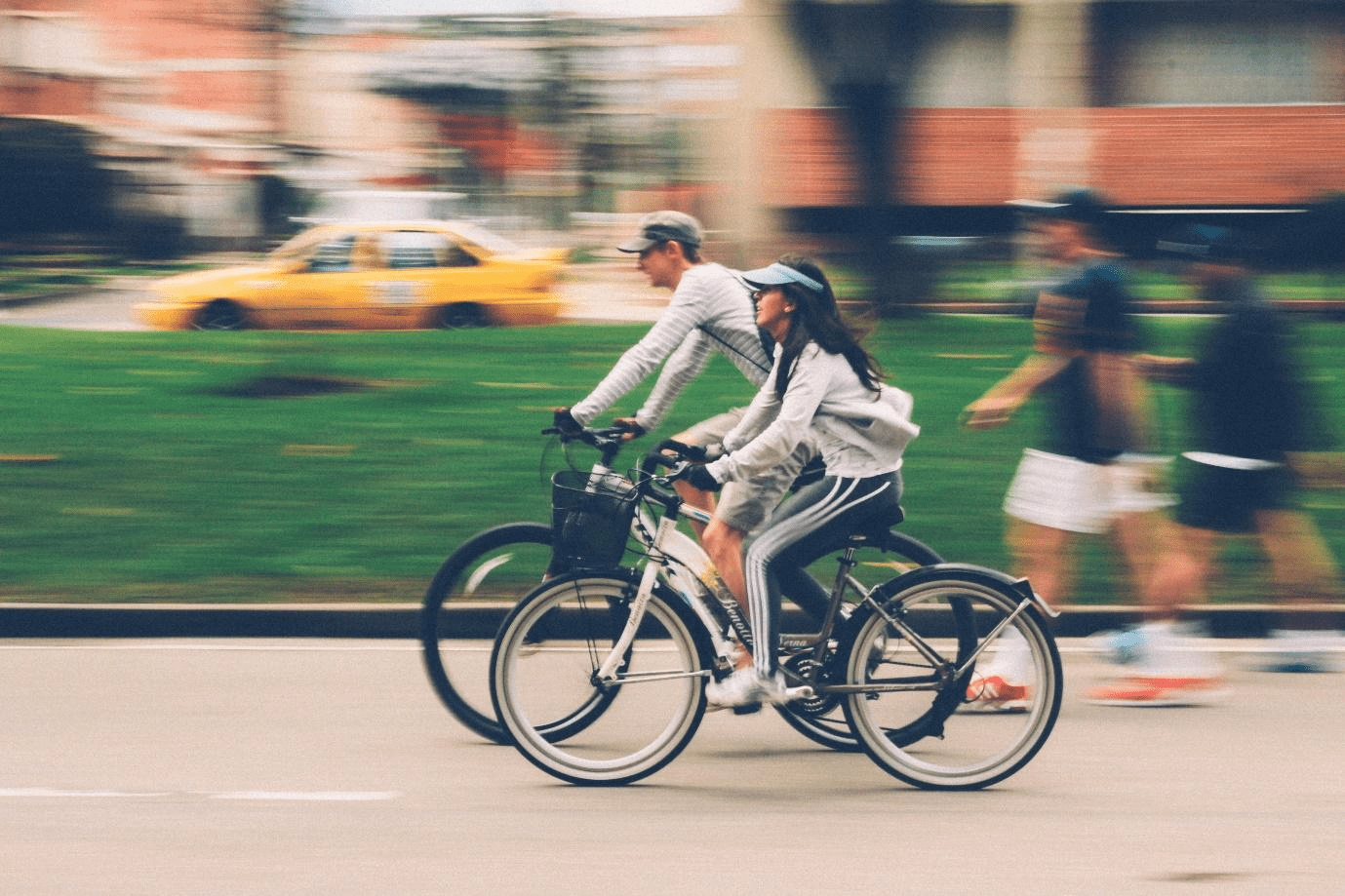 Woman and man riding bikes